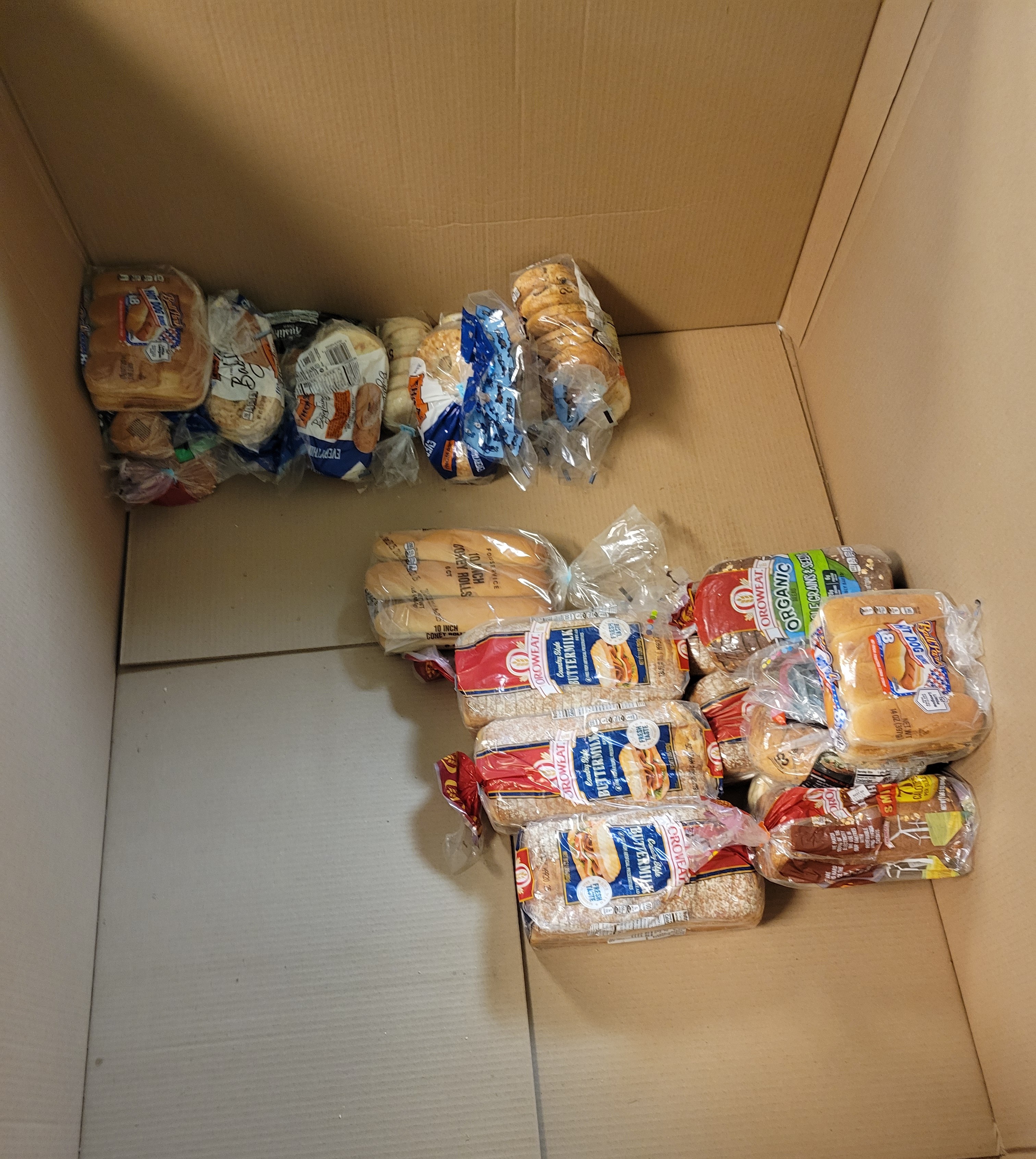 Cardboard container bottom with bread on it.